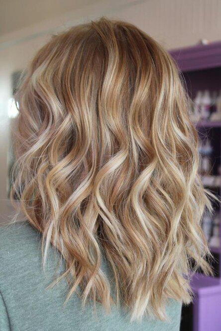 Rose Blonde | Freshen up for spring with these warm, sun-kissed shades. It’s only a matter of time before our winter hair starts feeling a bit lackluster and our tresses start begging for a little glow up. Forget about just choosing between blonde, brown, or red hair color—no, it’s all about hitting the right spot on the spectrum of tones within your favorite hue for your most flattering look yet. Warm blonde shades, unlike cool or neutral blonde shades, give that instant brightening boost
